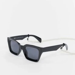 URBAN CLASSICS Herren Sonnenbrille Sunglasses Poros With Chain In Schwarz